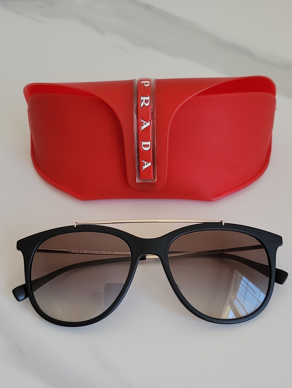 Prada SPS 02T Black Frame Sunglasses with Red Logo Case